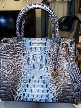 Authentic Brahmin with Beige Interior and shoulder and crossbody strap.